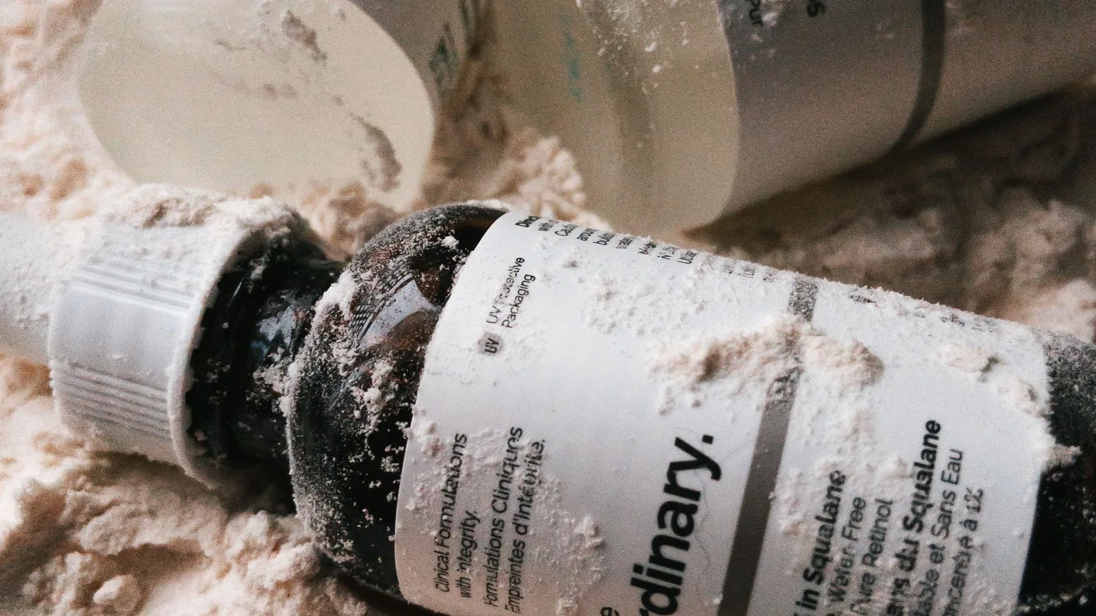 Retinol and skincare bottles arranged for comparing active ingredients.