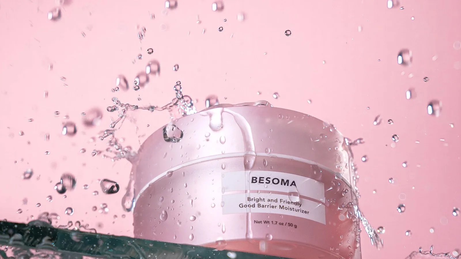 A person gently cleansing their face as part of a simple skincare routine.