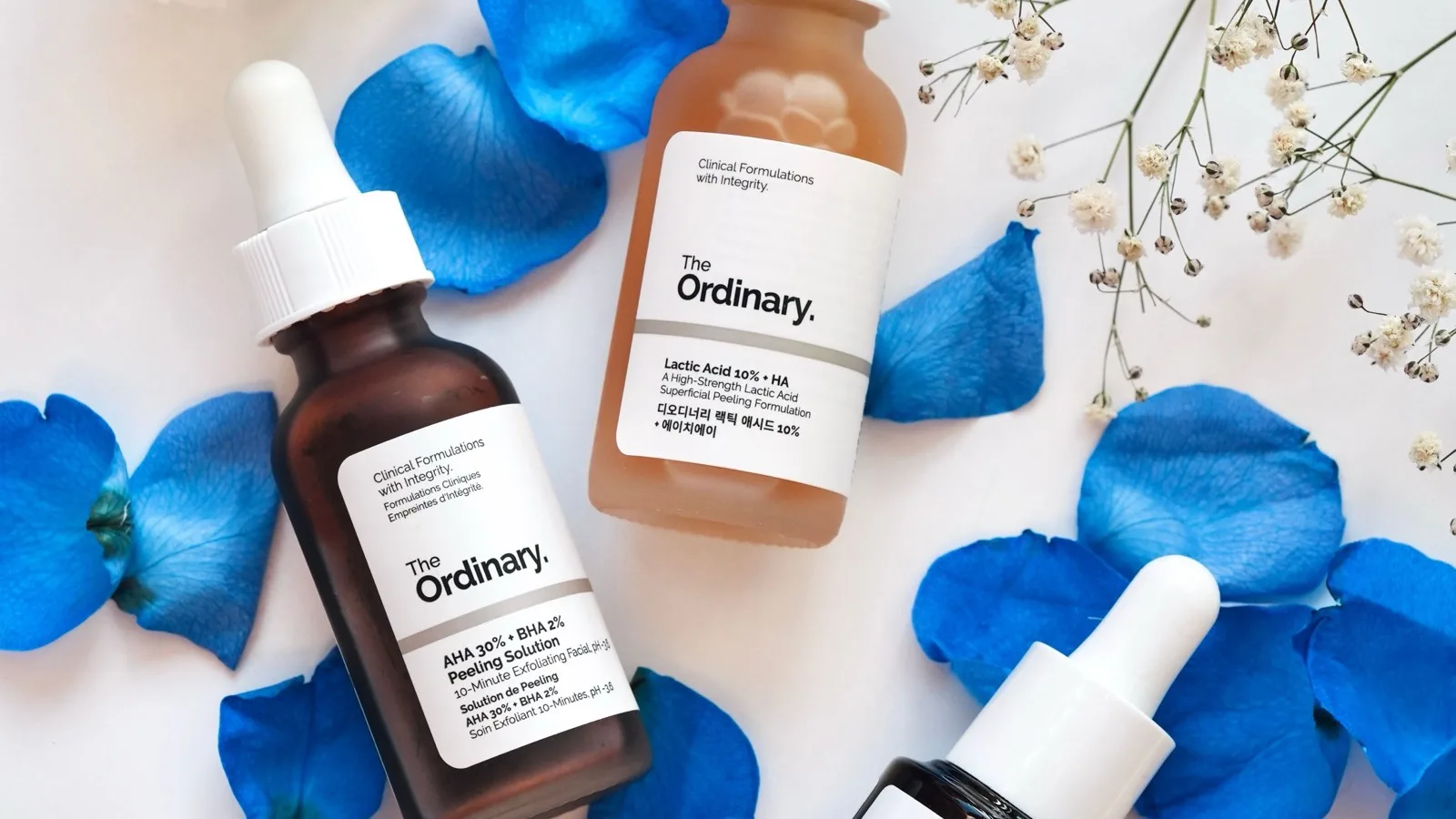 Skincare products arranged for comparing dark-spot care options.