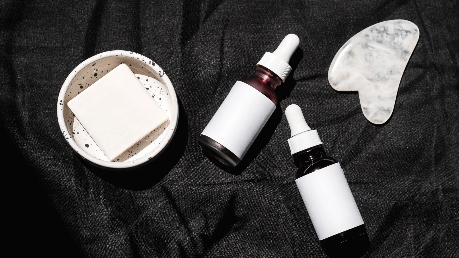 Skincare products and serums arranged for comparing product categories.
